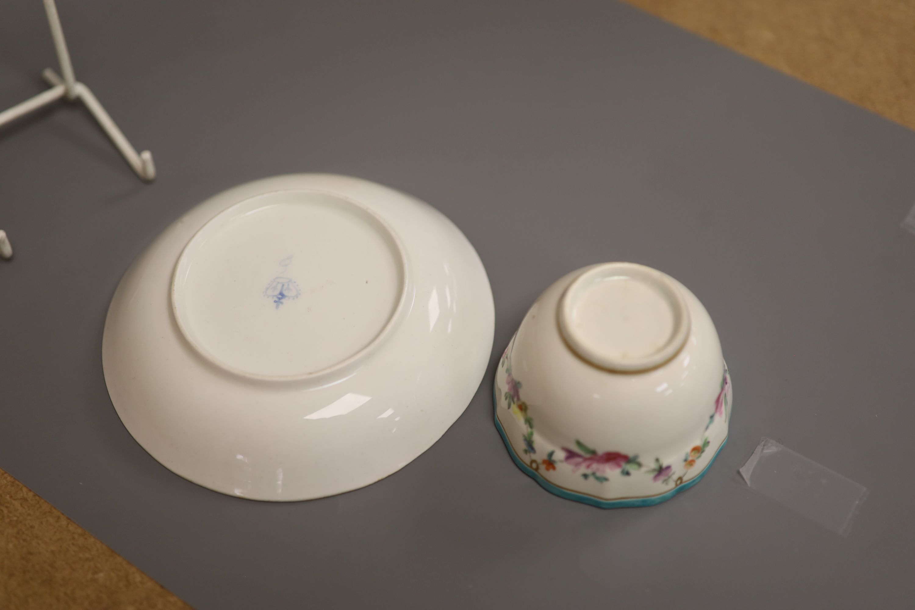 A Chelsea Derby teabowl and saucer painted with flowers, c.1778, blue Crown Derby mark with no batons, diameter 13cm